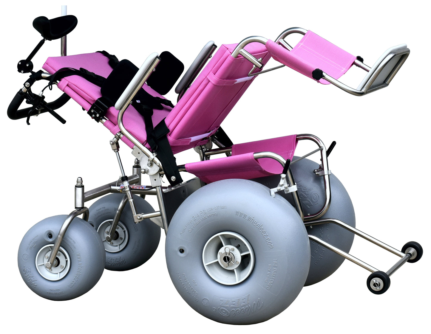 tilt in space reclining wheelchair tilted back with no one in the chair. The chair is pink.