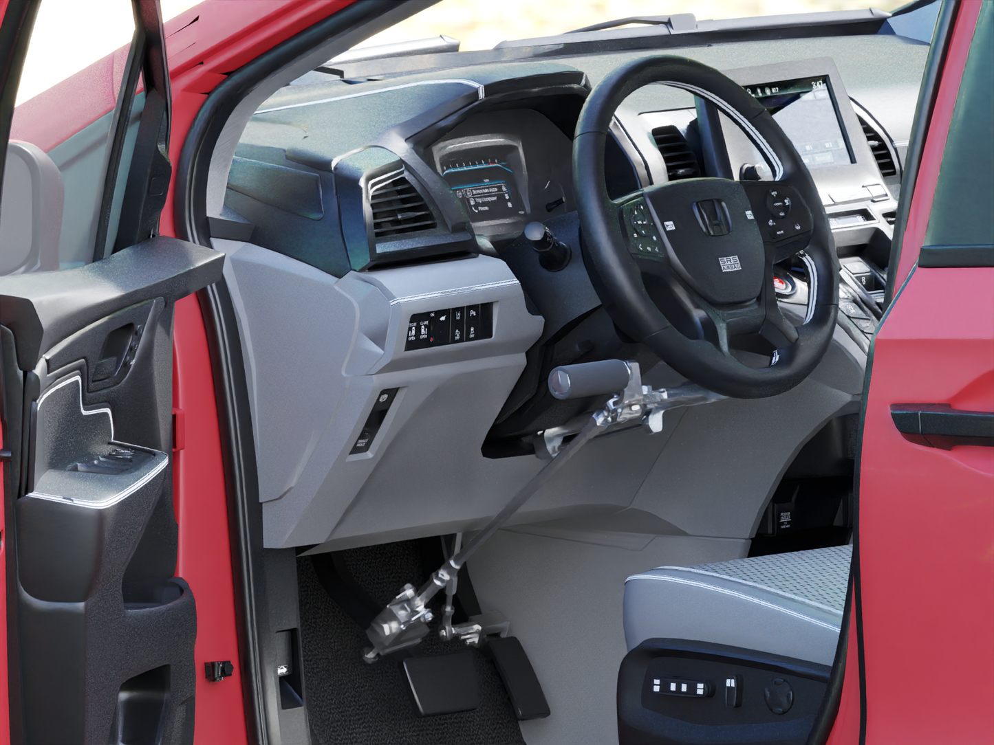 Hand controls in a red vehicle