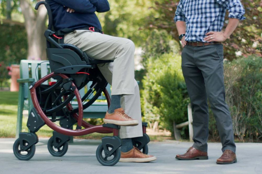 zeen in use with a man standing talking to another man.