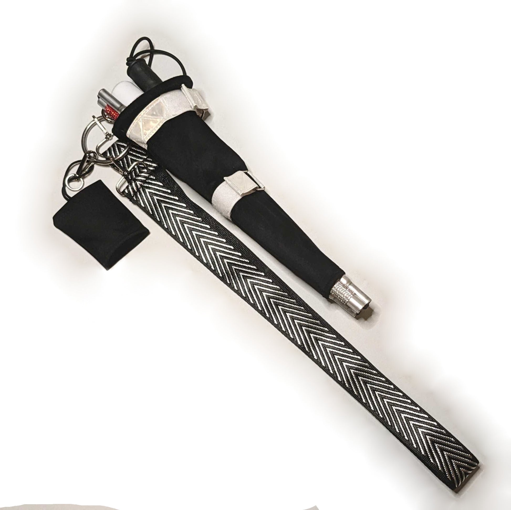 A black and white Kane Keeper bag to hold the Glam Cane.