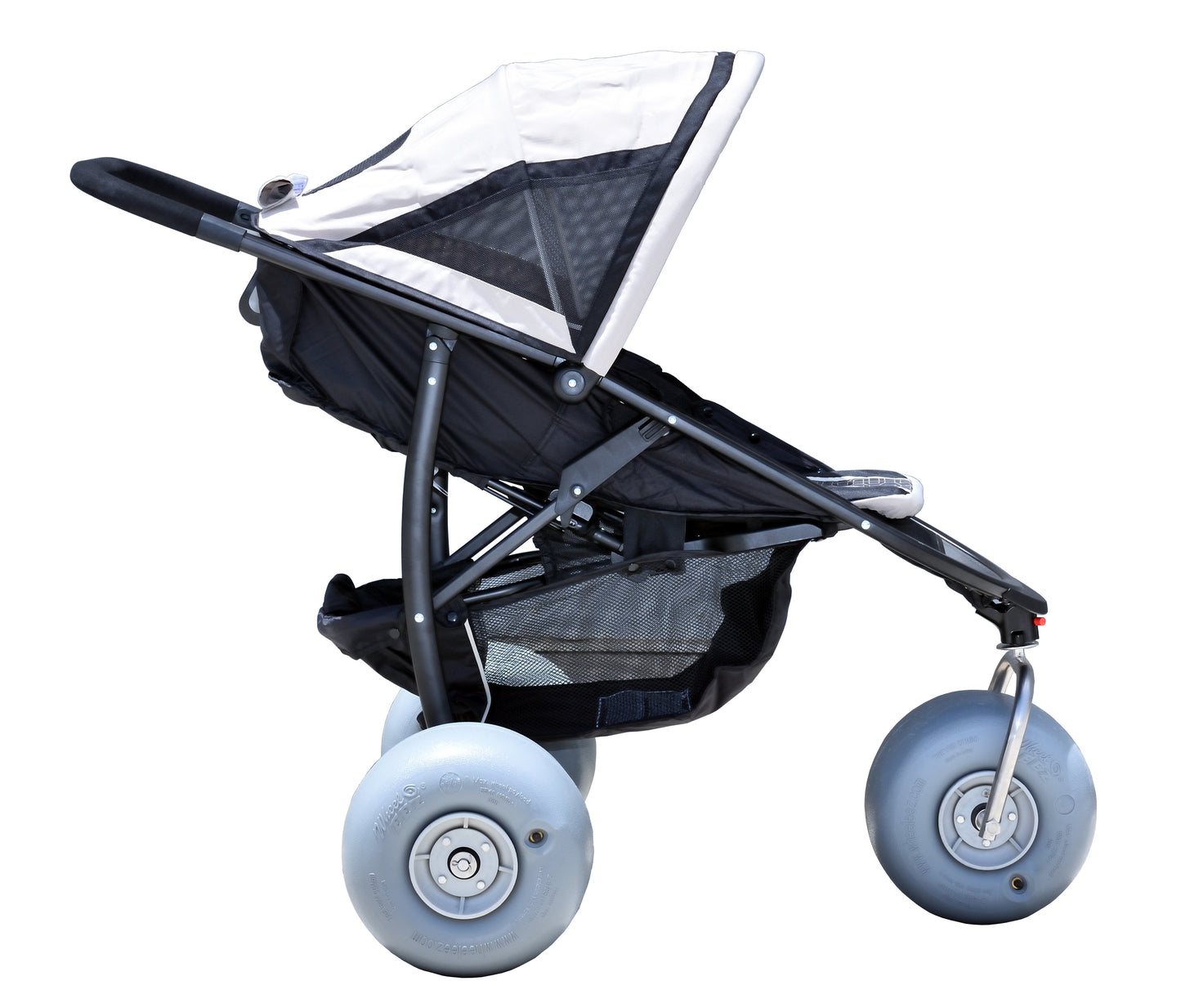 Black stroller with large beach wheels on a white background
