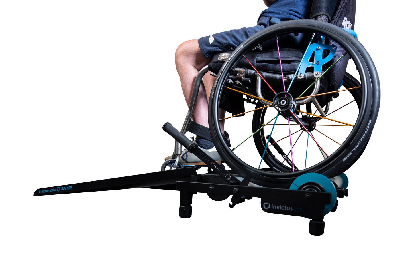 Wheelchair training roller with Man using it. View from a side angle.