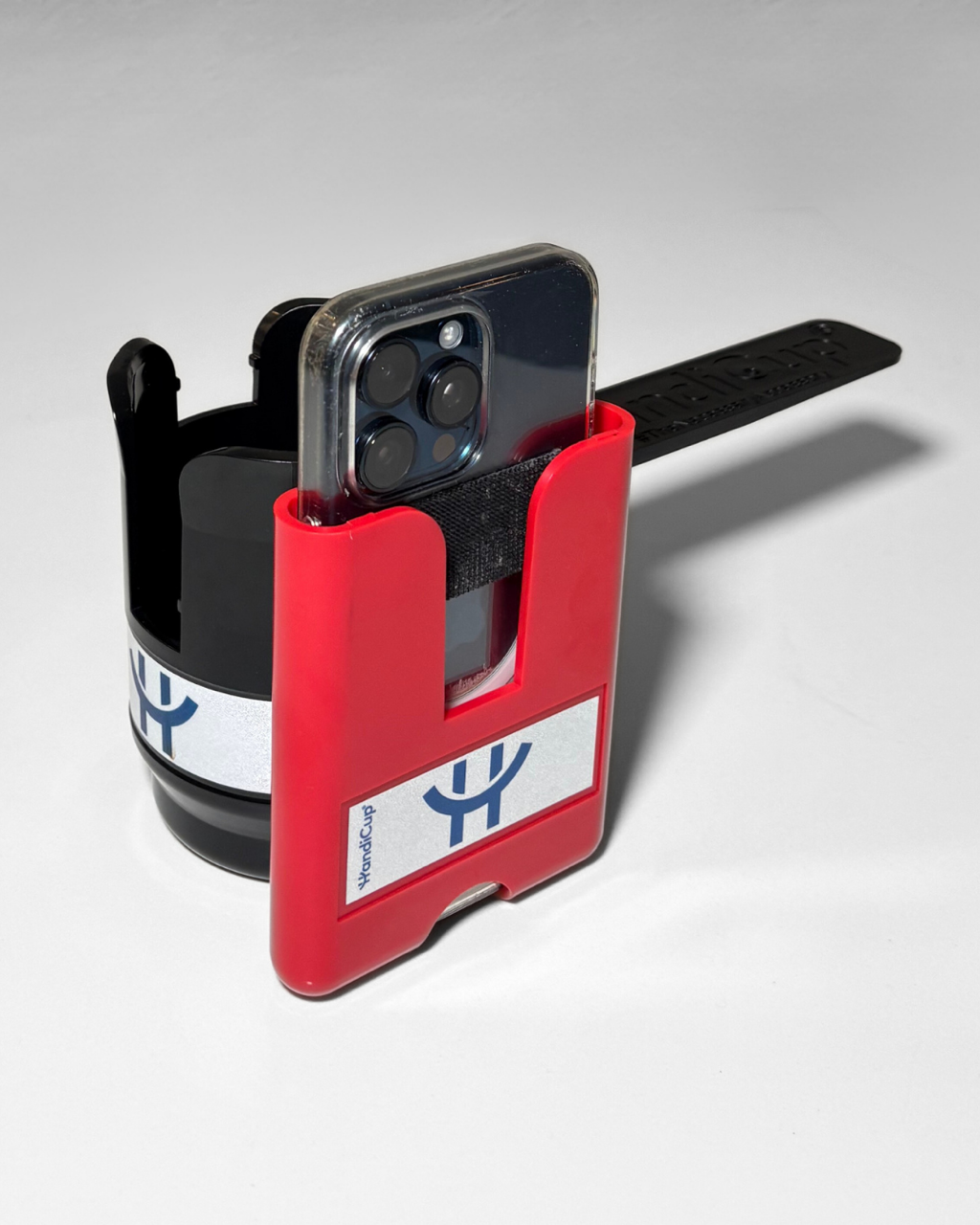 Phone holder attached to the wheelchair cup holder in the color red