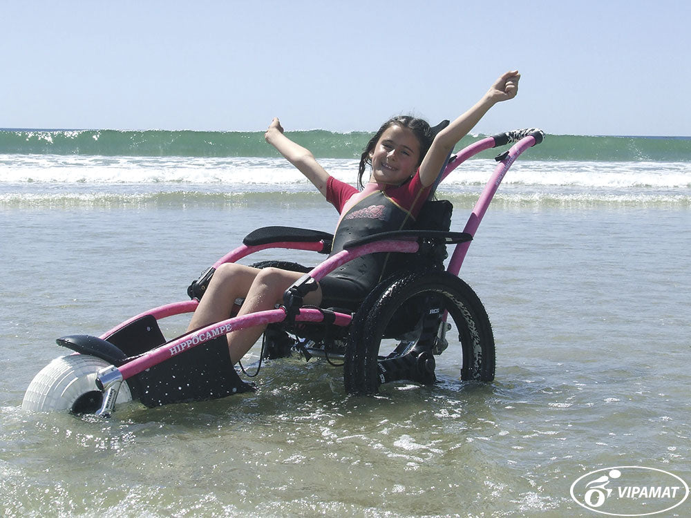Beach and All-terrain Hippocampe Chair pink in the ocean surf