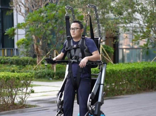 standnwalk with man walking in it showing the harness from the front. 